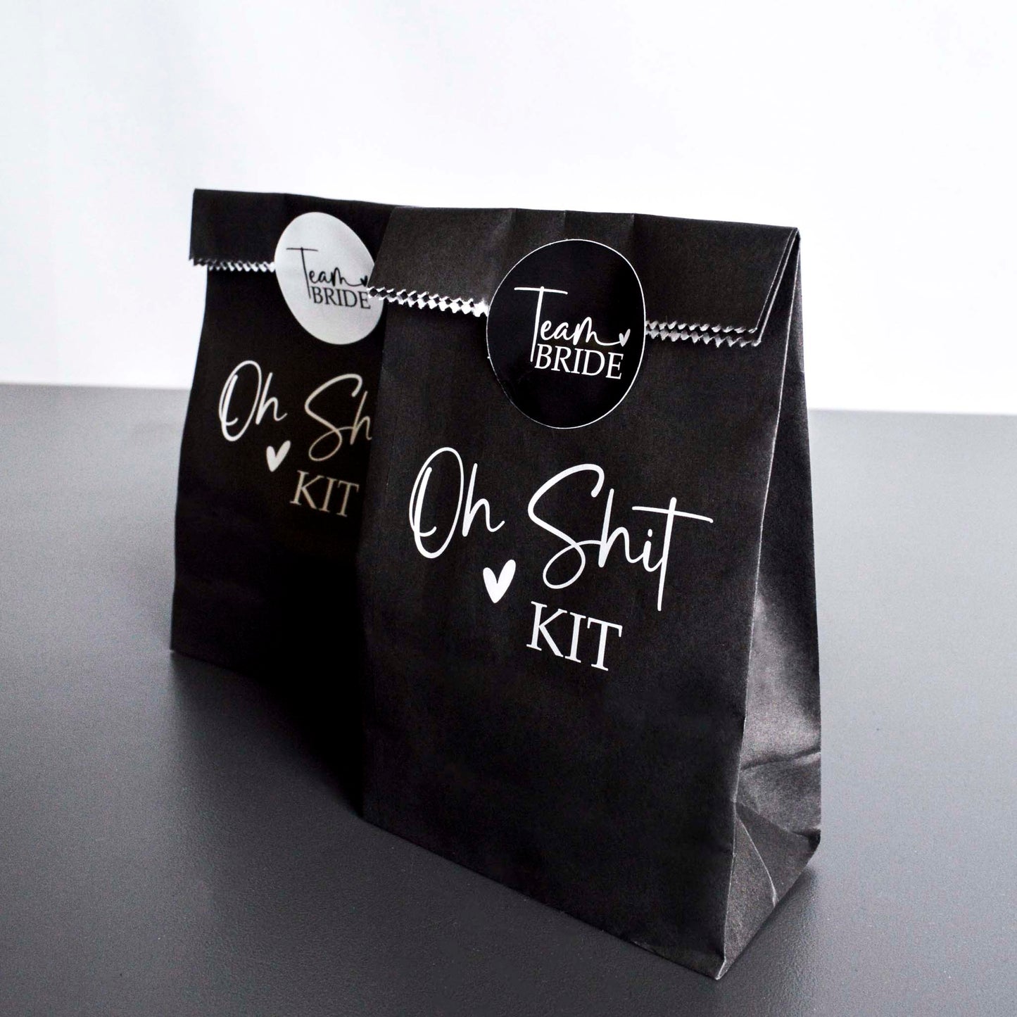 A set of 2 Team Bride Hen Party Hangover Kit Bags with Team Bride Stickers.