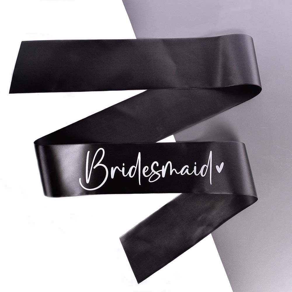 A black Bridesmaid Hen Party Sash printed in white, displayed on a grey background.