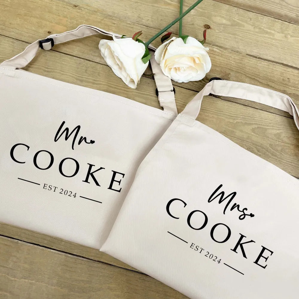 Couples apron set in natural with black print. 