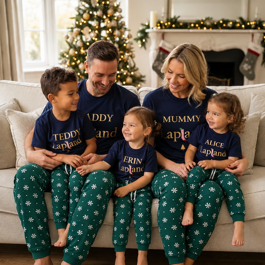 A family wearing personalised matching Lapland Family Pyjamas