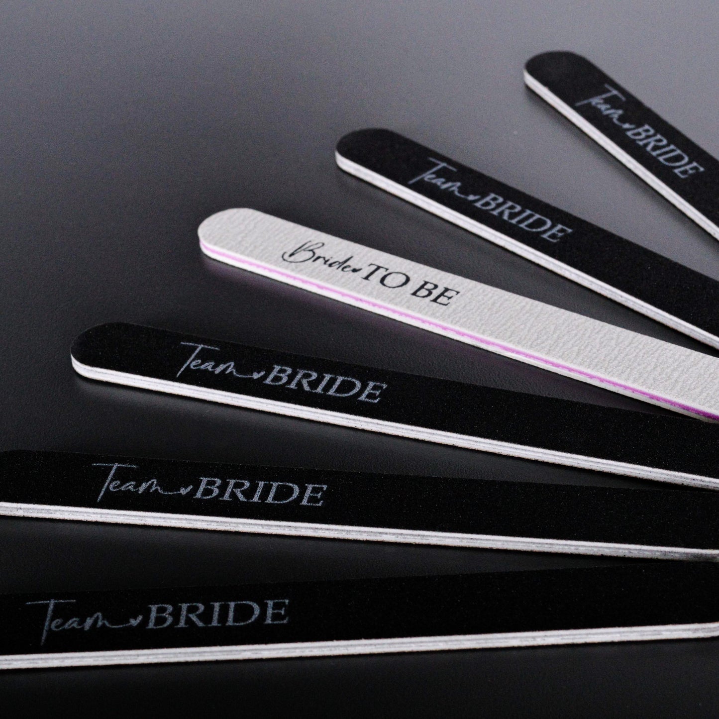 A group of hen party nail files in black and white. 