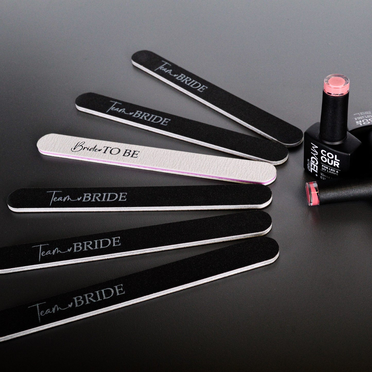 A group of black and white hen party nail files printed with team bride and bride to be. 