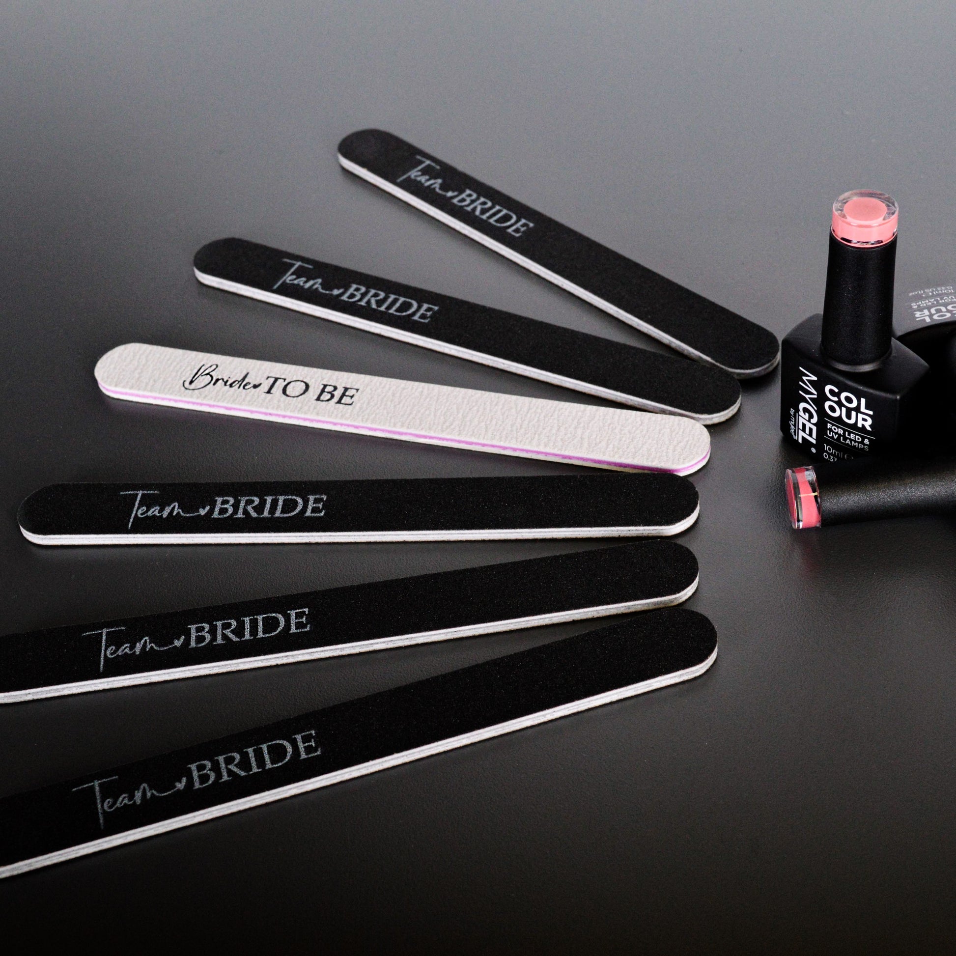 A group of black and white hen party nail files printed with team bride and bride to be. 
