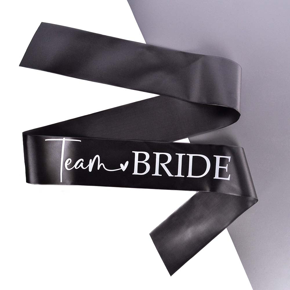 A black and white Team Bride Hen Party Sash on a grey and white background. 