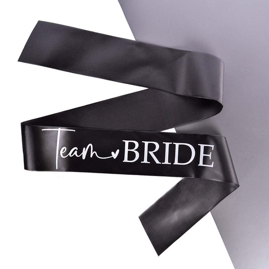 A black and white Team Bride Hen Party Sash on a grey and white background. 