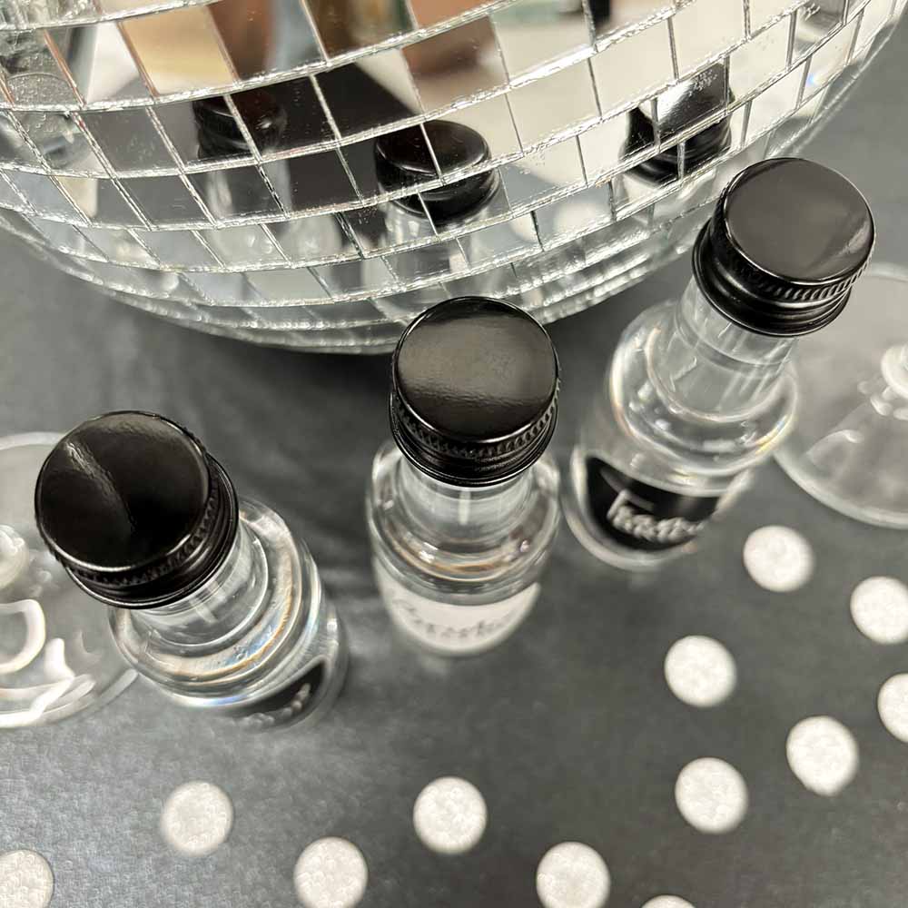 Team Bride Hen Party Shot Bottles with black caps.