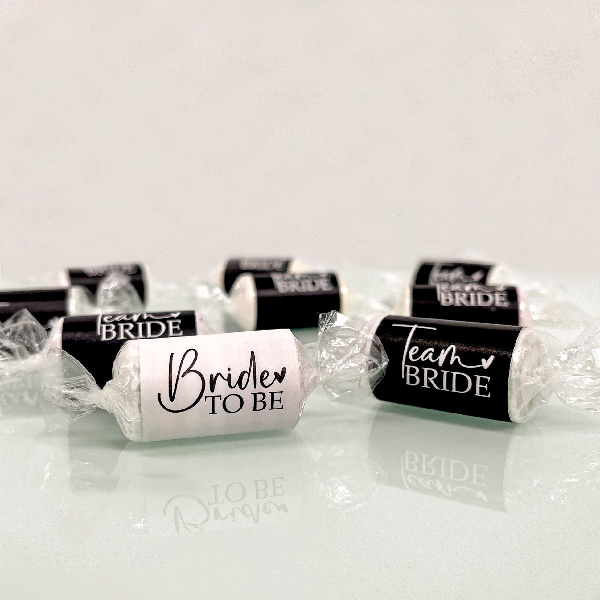 A set of Team Bride Hen Party Sweets in black and white. As well as Bride to Be Sweets in white and black. 