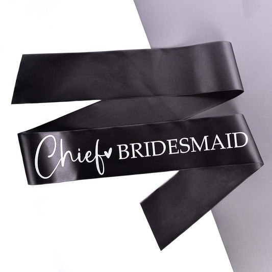 Black Chief Bridesmaid Hen Party Sash text in white on a grey and white background.