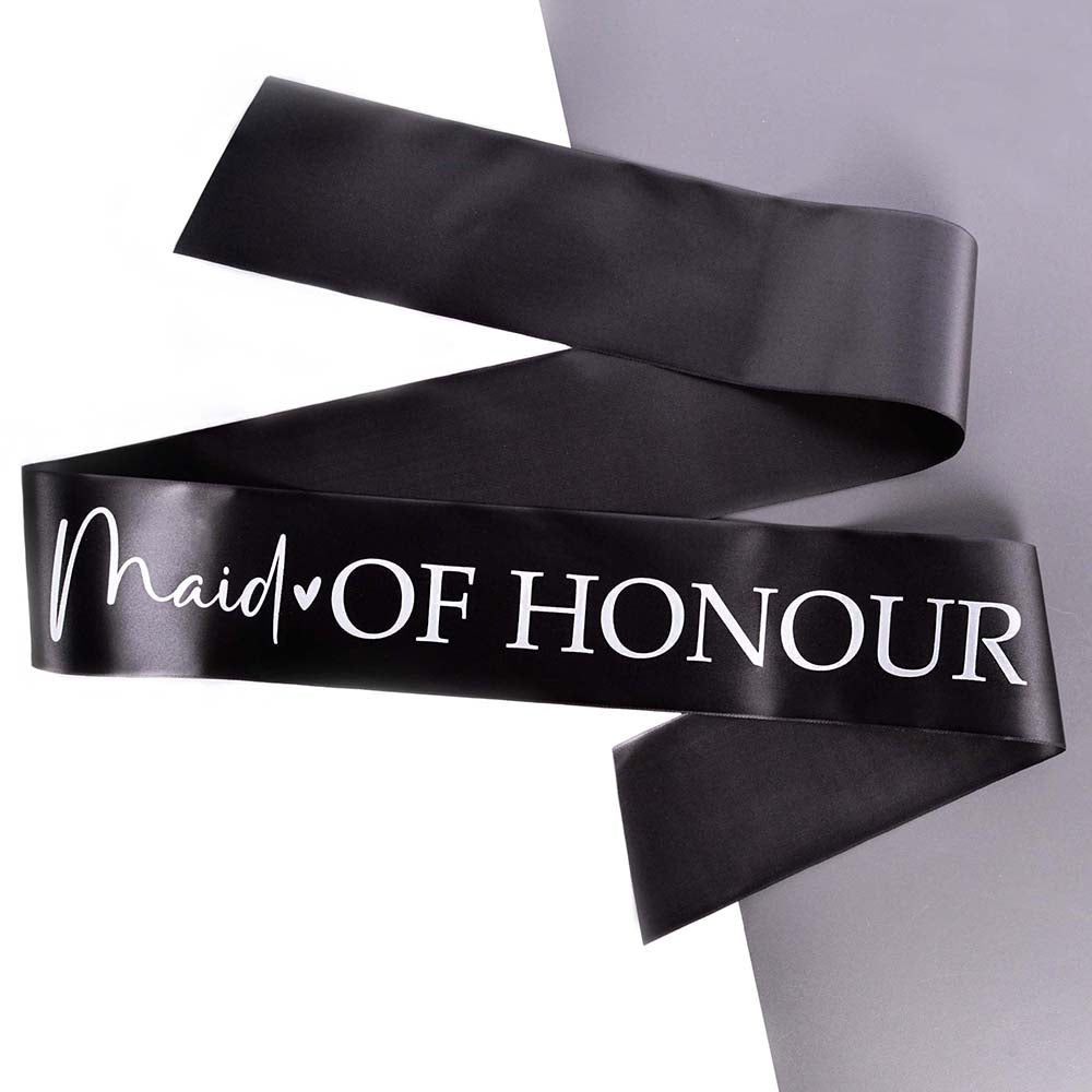 A black Maid of Honour Hen Party sash printed in white, on a grey background.