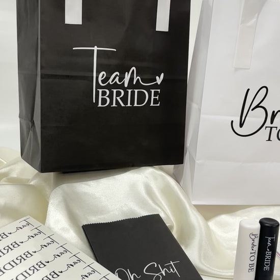 Black and white team bride hen party goodie bags video which also shows matching team bride hen party goodie bag fillers. 